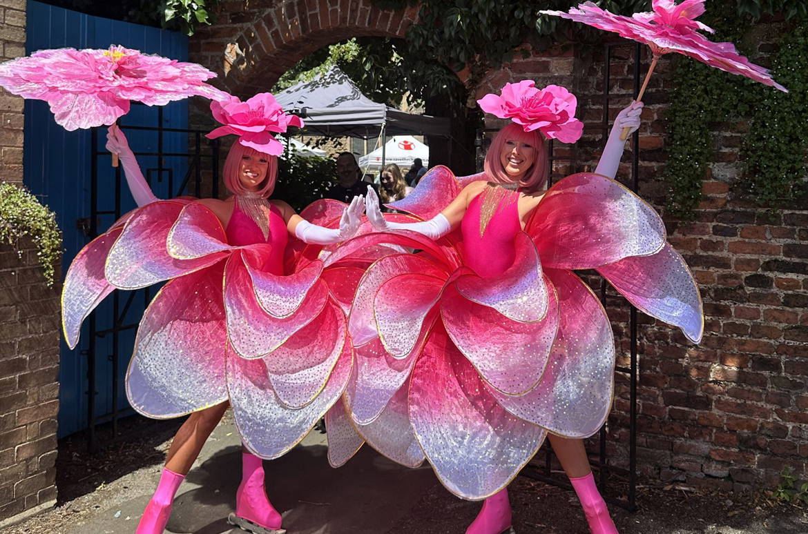 Rose stilt walkers